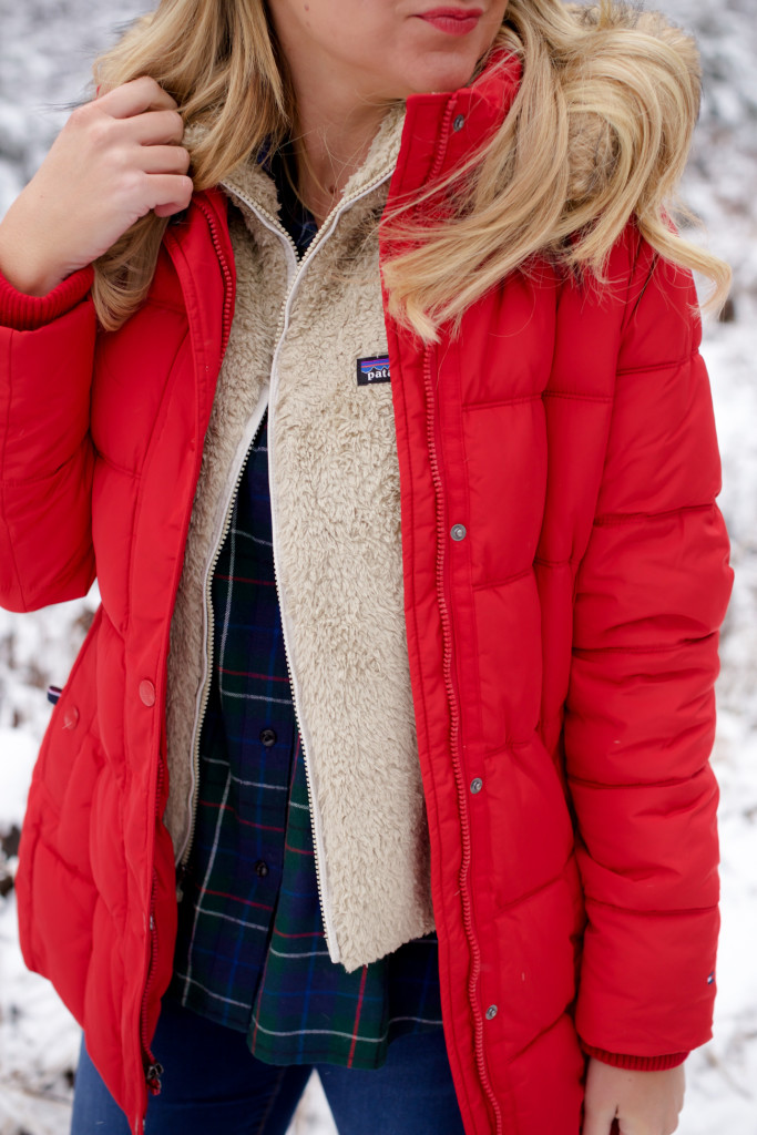 Red puffer snow coat with plaid shirt patagonia soft vest and ugg boots-11